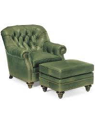 Some sun wearing on leather. Green Leather Tufted Armchair And Ottoman