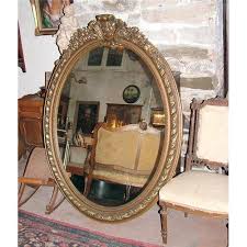 Maybe you would like to learn more about one of these? Large Oval French Carved Mirror Gilt Frame 2393421