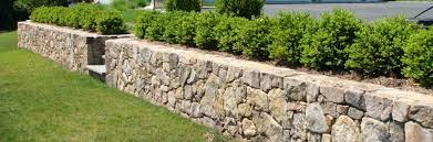 These retaining wall blocks, sold at stone yards and home centers, have a rough face for a quarried look and come in a variety of gray, tan, and red hues. Natural Stone Retaining Walls Materials Nj Ny Northern Nj Bergen County Passaic County