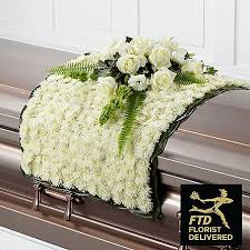 It is a revered and very special tribute. Adorn The Casket With This Stunning Blanket Of White Chrysanthemums Topped With A Beauti Funeral Flower Arrangements Funeral Floral Arrangements Casket Flowers