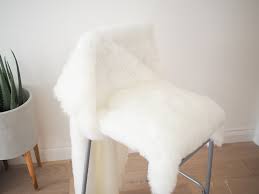This stool is made of a vintage footstool and some white fur, which contrast and make up a cool combo. Diy Faux Fur Bar Stool Tutorial Ikea Hack Bang On Style