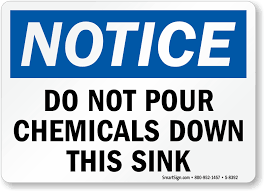 pour chemicals down this sink sign