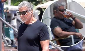 The rambo star, 74, cut a casual. Sylvester Stallone 74 Enjoys A Refreshing Drink On The Beach In Malibu Daily Mail Online