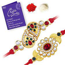 Rakhi is indian festival which is celebrated between brother and sister. Buy Sukkhi Royal Gold Plated Traditional Rakhi Combo Set Of 2 With Roli Chawal And Raksha Bandhan Greeting Card For Men Cb73446 At Amazon In