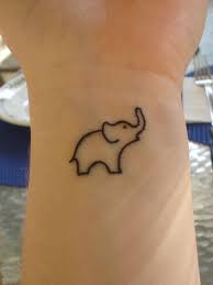 The upturned elephant trunk in the tattoo is said to bring good luck, wisdom, and discernment. Simple Elephant Tattoo Trunk Up
