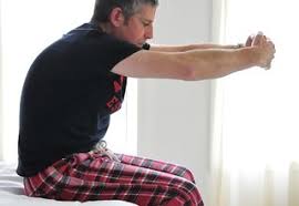 After doing the previous stretch with both legs together, hold the big toe on each leg and lift the calves towards your upper body. 5 Minute Wake Up Workout Nhs