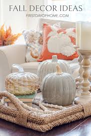 Curved flower glass centerpiece on a cherrywood dining table. Easy Inexpensive Fall Decorating Ideas For Your Home