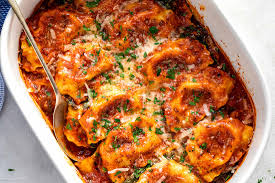 Arrange half of the frozen ravioli in single layer over sauce; Easy Tomato Spinach Ravioli Bake Recipe Baked Ravioli Recipe Eatwell101