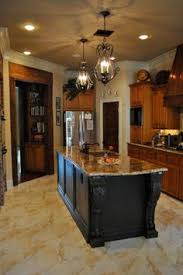 This tuscan italian inspired kitchen features a rustic mix of natural textures. 14 Tuscan Lighting Ideas Tuscan Decorating Tuscan Tuscan Kitchen