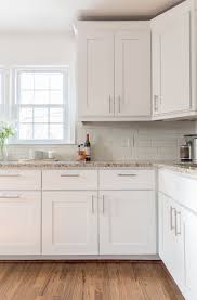 Bring tired kitchen cabinets back to life with a good cleaning, new hardware, a fresh finish and a few simple, creative accents. A Simple Kitchen Update Kitchen Cabinets Decor Kitchen Remodel Small Kitchen Cabinet Design