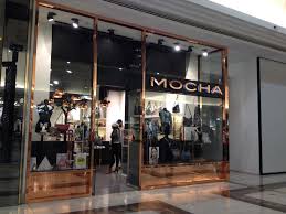 Mocha Has Applied A Faux Copper At The Facade The Wavy Ceiling Has Been Achieved Through The Use Of Black Painted Chains The Light Features Match The Use Of