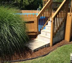 Pool decks 888 89 pools see prices here connect a deck pool entry deck system our pool decks are made of outdoor pressure treated lumber. How To Hide An Above Ground Pool In A Landscaped Backyard Hawk Hill