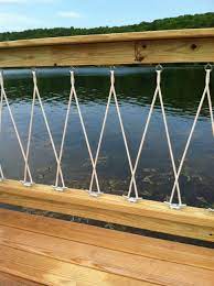 Building and installing deck landing with round treated poles, thick rope rails, vinyl decking. Close Up Deck Railing Design Beach House Decor Lakehouse Decor
