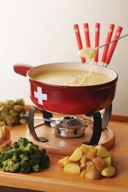 warm up those winter nights the swiss way and savour a delicious selection of fondue and raclette at az switzerland food traditional food switzerland food