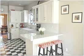 Standard cabinets could go all the way to the ceiling by adding crown molding and trim in the gap between the top of the cabinets and the ceiling. Home Tour Custom Kitchen Cabinets White Kitchen Tiles White Kitchen Floor