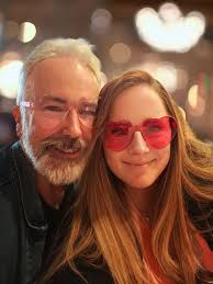 Can someone remove heart shaped glasses from our photo?