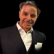 I used to think success looked like long hours and a Manhattan office. I  walked past Wall Street last week to visit a few clients. It's where I  started my career. Suit,