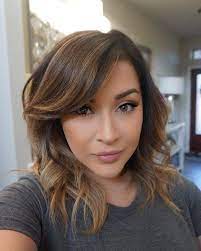 The long side bang is tucked under the curls of the hair. 47 Fresh Hairstyle Ideas With Side Bangs To Shake Up Your Style