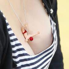 Tiny Figurines Dive Into Women S Breasts In Naughty Necklaces By Takayuki Fukusawa Necklace Pendant Jewelry Inspiration
