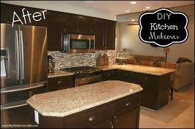 Accent colors include a deep brown range hood, black kitchen island, and deep grey marble countertops. Diy Staining Kitchen Cabinets Dark Espresso Stained Kitchen Cabinets Kitchen Diy Makeover Classic Kitchen Cabinets