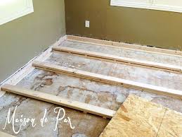 Raise the lower end of the level until the bubble is centered, then measure the distance from the bottom of the level to the floor to find the depth of the dip. My Brilliant Husband And Our New Office Floor Maison De Pax Diy Flooring Flooring Best Bathroom Flooring