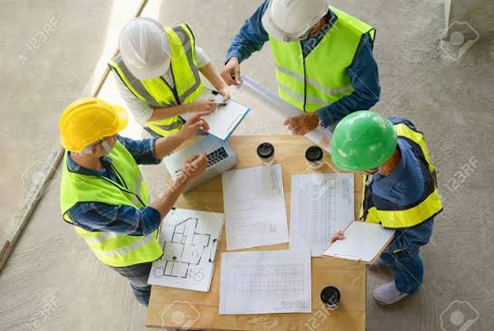 Engineering Teamwork Meeting On Site Work,engineers Project Manager  Consultation Meeting With Coworker.concept Of Engineering Or Architecture  Working Outdoors For A New Real Estate Home Project Stock Photo, Picture  and Royalty Free Image.