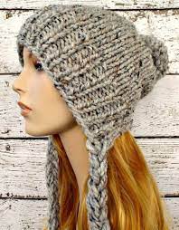 This elegant earflap hat knitting pattern is very easy to make, and has a simple, classic style! Knitting Pattern For Slouchy Earflap Hat The Charlotte Beanie Is A Quick Knit Using Only One Skein Of Yarn And Can Easily Knitted Hats Knitting Crochet Hats