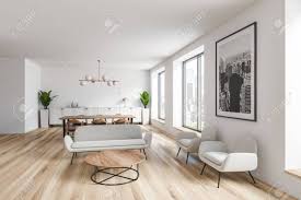 White walls give you the freedom to pile on the colour and pattern and change things as often as you like without repainting. Interior Of Spacious Living Room With White Walls Wooden Floor Stock Photo Picture And Royalty Free Image Image 127789160
