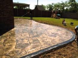 Backyard stamped concrete patio with border blackwater. What Is Stamped Concrete Decorative Concrete Or Pavers Better
