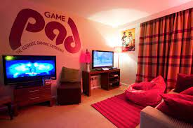 Coolest Gaming Room Decor Ideas To Give Your Gaming Room A Realistic Touch Cool Gaming Rooms House Decorating Games Playroom Design