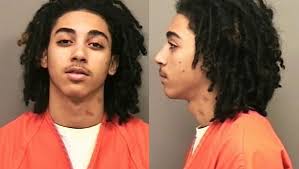 Murder suspect accused of pointing gun at victim's mom