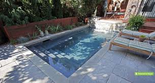 Perfect For Exercise Or Entertaining This Compact Plunge Pool Tucks Neatly Behind The House In This Small Pool Design Hot Tub Backyard Swimming Pools Backyard