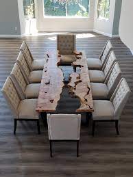 This custom live edge furniture package features gold legs, blue chairs, and a single slab of reclaimed walnut. San Diego Live Edge Wood Tables Custom Furniture River Table