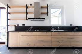Kitchen furniture with black granite. New Crafted Kitchen In Wood Stainless Steel And Black Granite Stock Photo Picture And Royalty Free Image Image 97785448