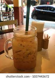 Teh tarik (literally pulled tea) is a popular hot milk tea beverage most commonly found in restaurants, outdoor stalls and kopitiams within the southeast asian countries of malaysia, indonesia and singapore. Malaysia Called Teh Tarik Ais Which Stock Photo Edit Now 1037443672