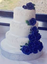 Chocolate butter cake (thank you, martha stewart!) with chocolate mousse and dark chocolate buttercream frosting. 3 Tier Wedding Cake With Navy Blue Fondant Roses And White Fondant Applique Roses On Each Tier Tiered Wedding Cake 3 Tier Wedding Cakes Fondant Rose