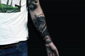 Compass and map tattoo design for men on upper half sleeve. Top 40 Best Arm Tattoos For Men