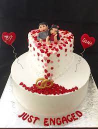 Happy birthday cakes love cake jelly cake summer wedding cakes 25th birthday cakes celebration cakes engagement cake design valentines cakes and cupcakes valentine cake. Engagement Cake With Cute Couple Toppers Whipped Cream Cake With Fondant Accents Engagement Cake Images Engagement Cake Design Themed Cakes