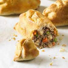 Cornish Pasty Chunks Of Steak And Minced Beef With Potato Onion Carrots And Peas Lightly Seasoned And Enclose Pasties Recipes British Food Cornish Pasties