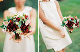 The deep, rich color stands out, especially now that a lot of brides are opting to go for pastels and neutrals (which isn't a bad thing!). Deep Red Light Pink Bridal Bouquet With Green Blue Details
