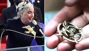 Even when the hunger games series gets winded pimping old tricks, lawrence is the oxygen that brings it back to life. Twitter Reacts To Lady Gaga S Hunger Games Inspired Dove Pin