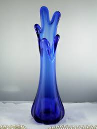 Large cobalt blue glass bottle and glass. Light Blue Glass Vase Bmo Show