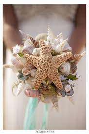 Then inserted into a floral foam ball. 320 Seashell Bridal Bouquet Ideas In 2021 Seashell Bouquet Beach Wedding Bridal Bouquet
