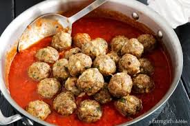 Place the italian sausage in a large mixing bowl and massage it with your hands, breaking it down. Spicy Italian Sausage Meatballs Over Egg Noodles A Farmgirl S Dabbles