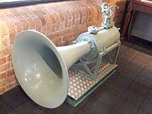 Well it works by forcing compressed air onto a diaphragm which will vibrate creating a deep sound which is then reflected back through a tube which is then amplified through a funnel shape creating the deep sound of a train horn and here is the final product Air Horn Wikipedia