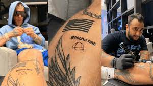Jake paul receives 'gotcha hat' tattoo, creates custom merch after mayweather brawl. Jake Paul Was Bored At The Airport So He Got Tattooed Tattoo Ideas Artists And Models