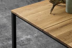 A coffee table with storage can help reduce clutter by adding extra space for remotes, throw pillows, magazines, and toys. Less Is More
