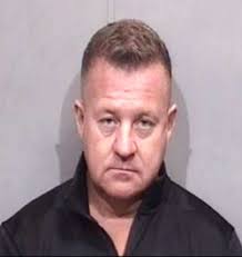 Former police officer and other man charged in bar incident