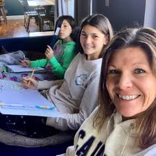 This is Betsy. Betsy is one of the many librarians and library staff  working behind the scenes to help you in your new online classes. Betsy is  sharing her new workspace with