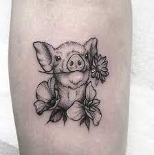 Keeping these explanations in mind, we do know the pig and rooster tattoo meaning is symbolic of good luck on the ocean and symbol to keep a sailor from drowning. Pig Tattoo With Flowers Poppy Iris And Marguerite Pig Tattoo Sleeve Tattoos Tattoos